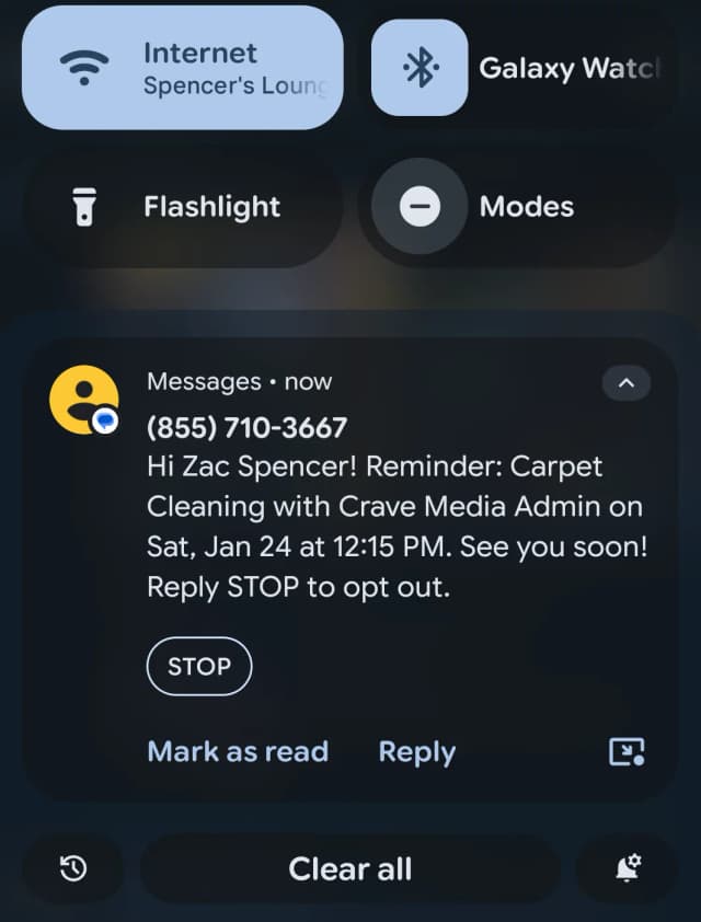 SMS notification on a phone showing automated appointment reminder